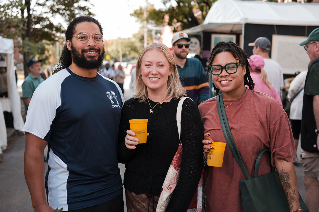 Friends smiling together at Louisville event