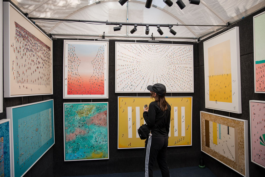 Looking at art at St. James Court Art Fair