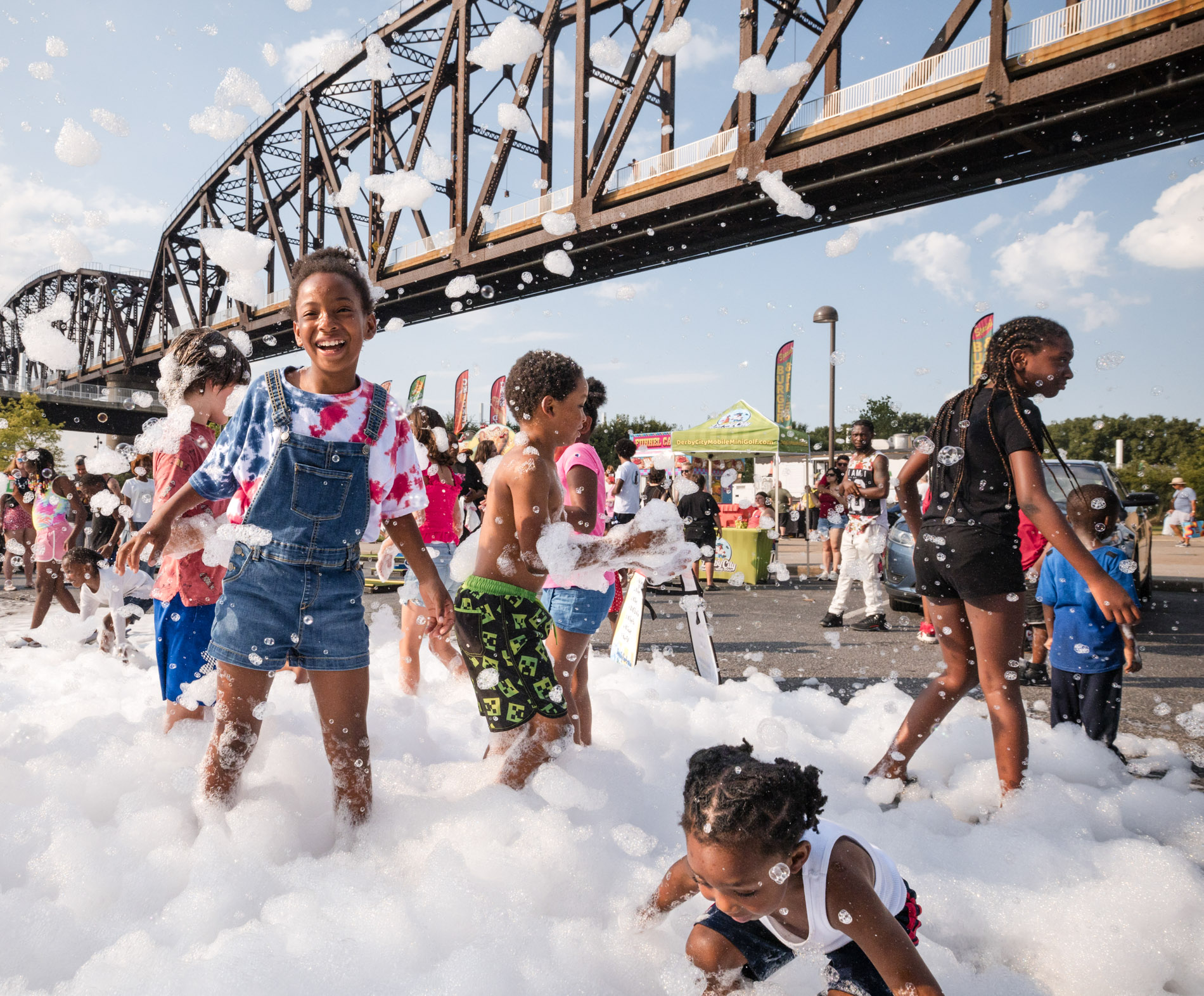 Louisville conference speaker — man in blazer presenting at corporate event podium