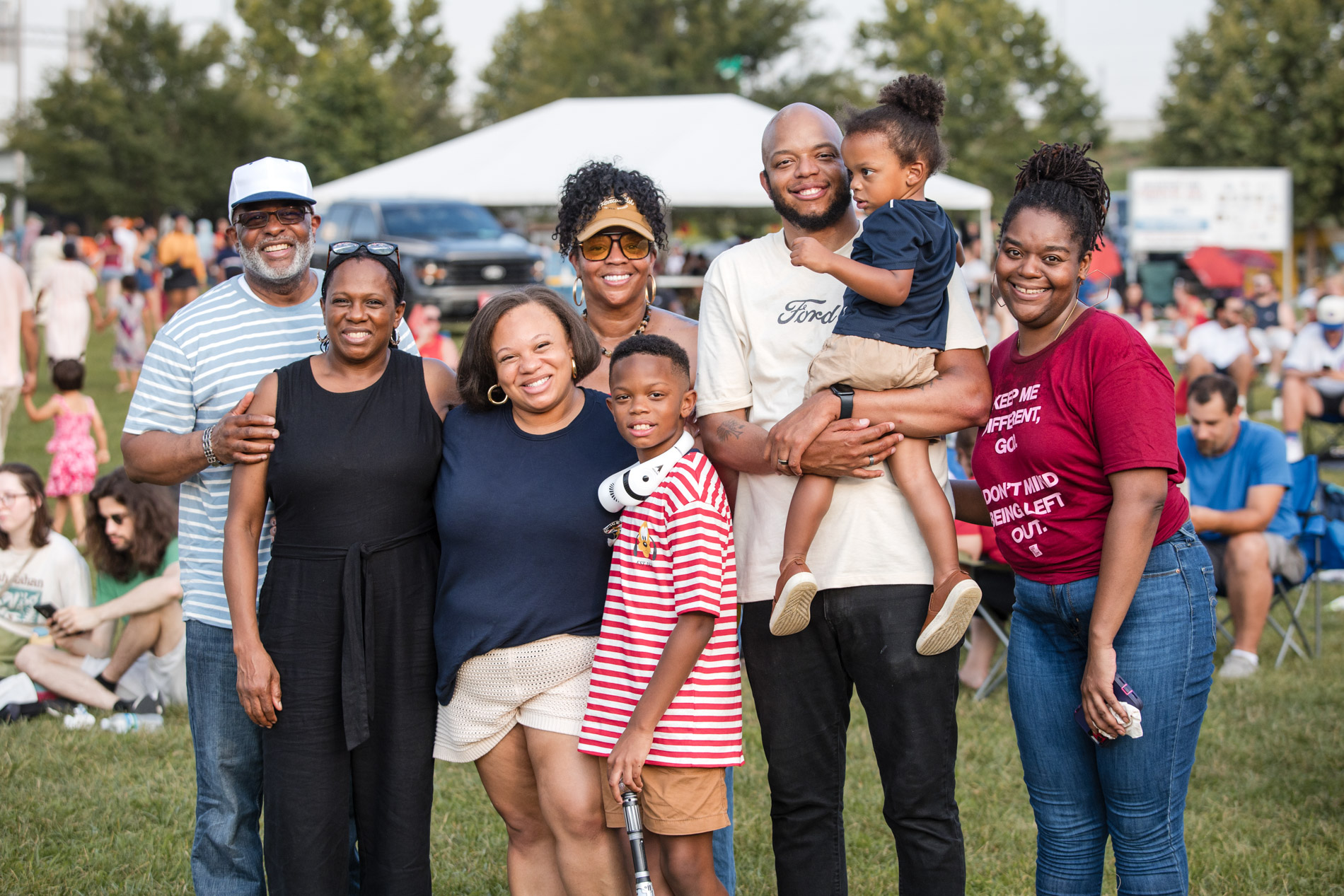 Louisville community event — family posing together at outdoor festival