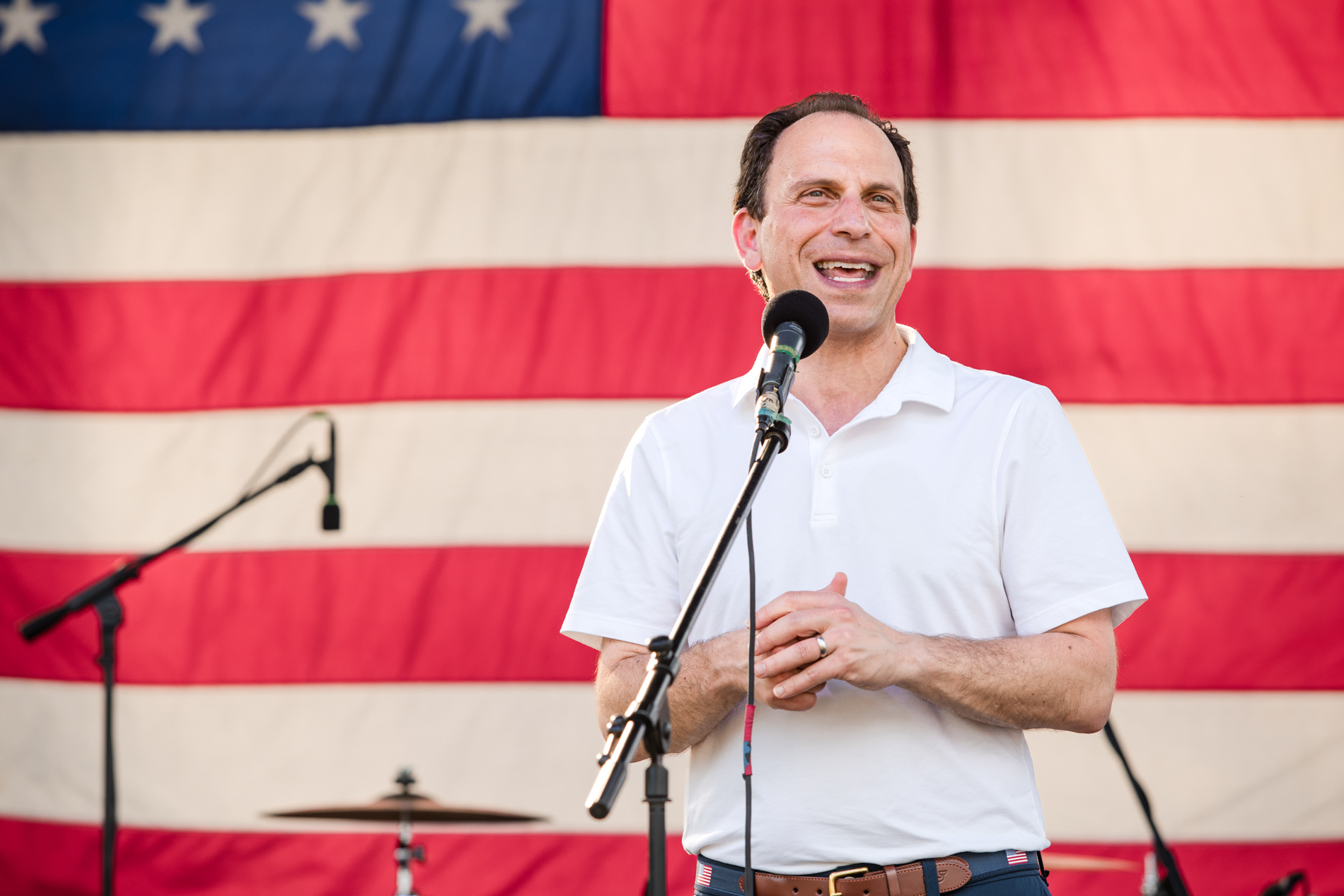 Louisville festival games — people playing cornhole at outdoor community event