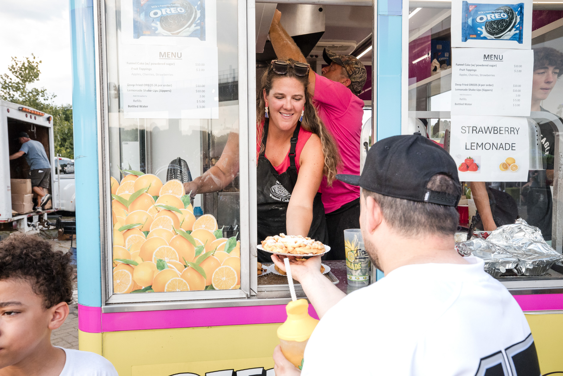 Louisville festival food vendor — serving customers at lemonade stand