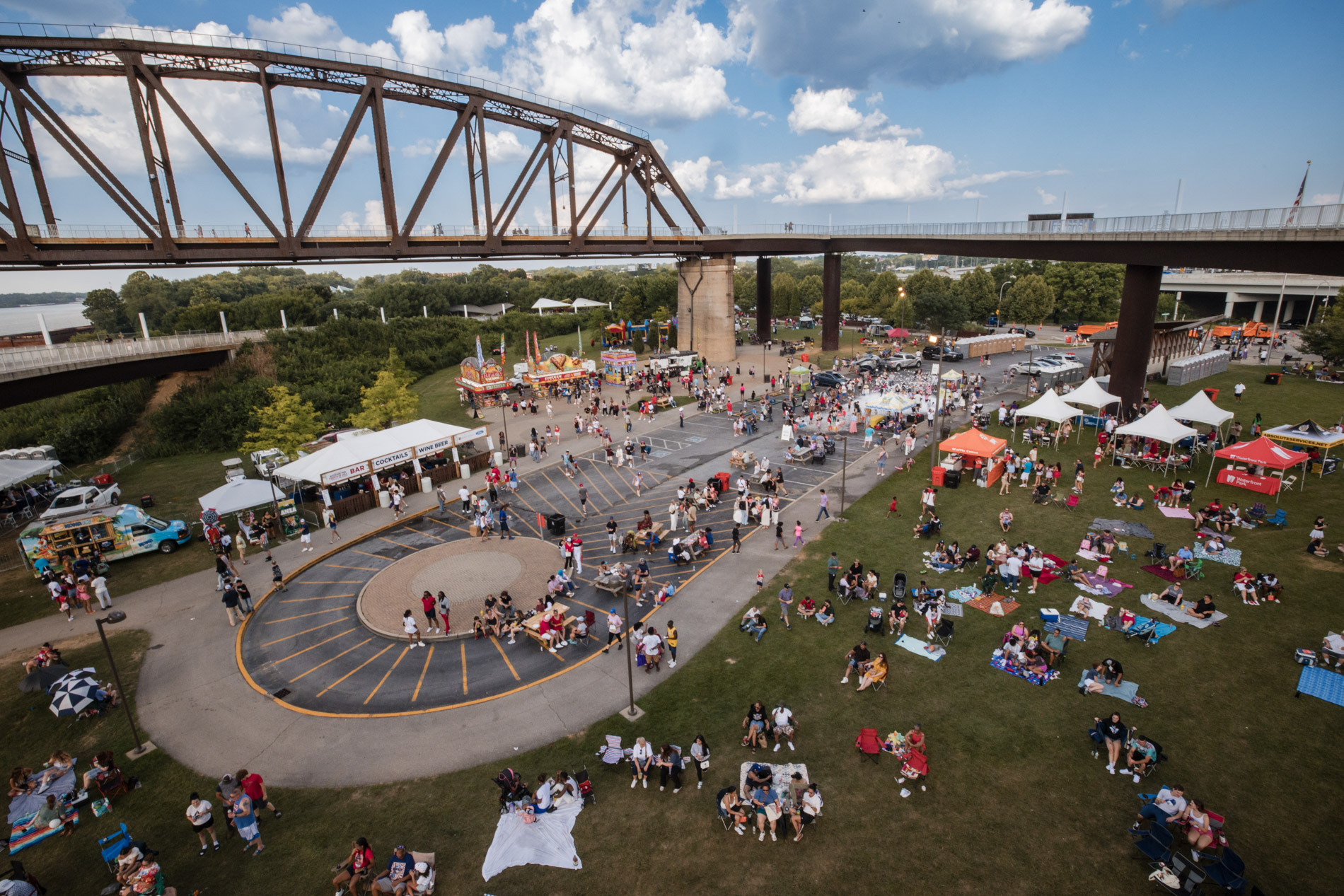 Louisville event speaker — man at podium with American flag backdrop